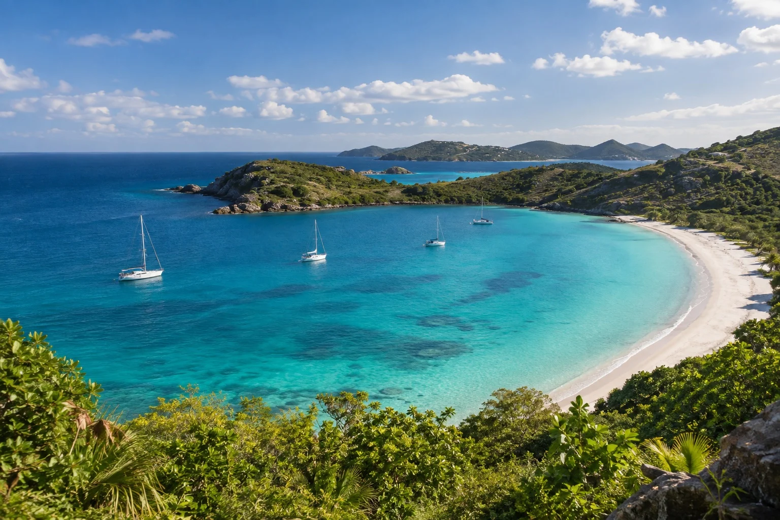 Caribbean coastline with turquoise water and green hills